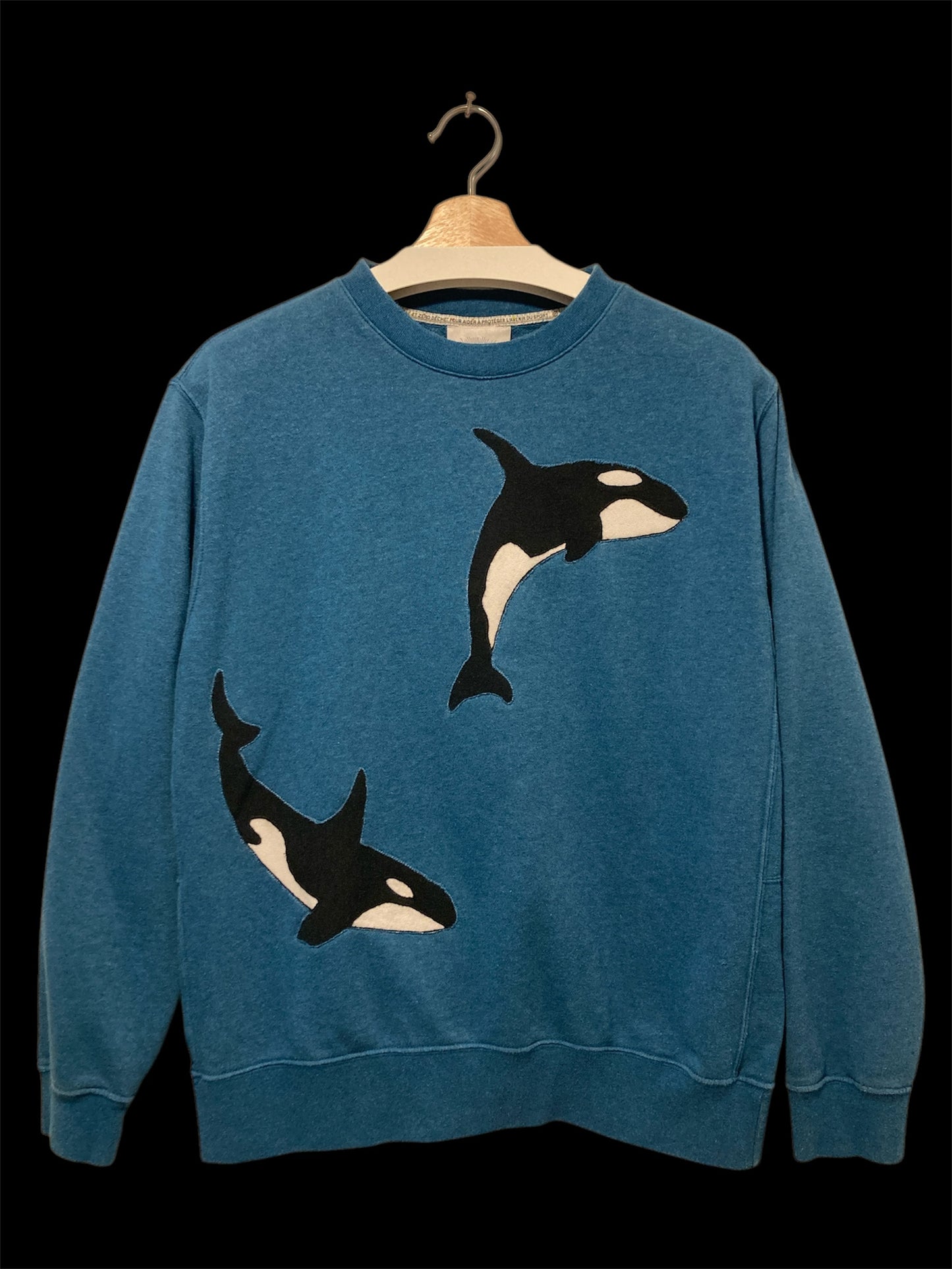 Upcycled Orca sweatshirt.
