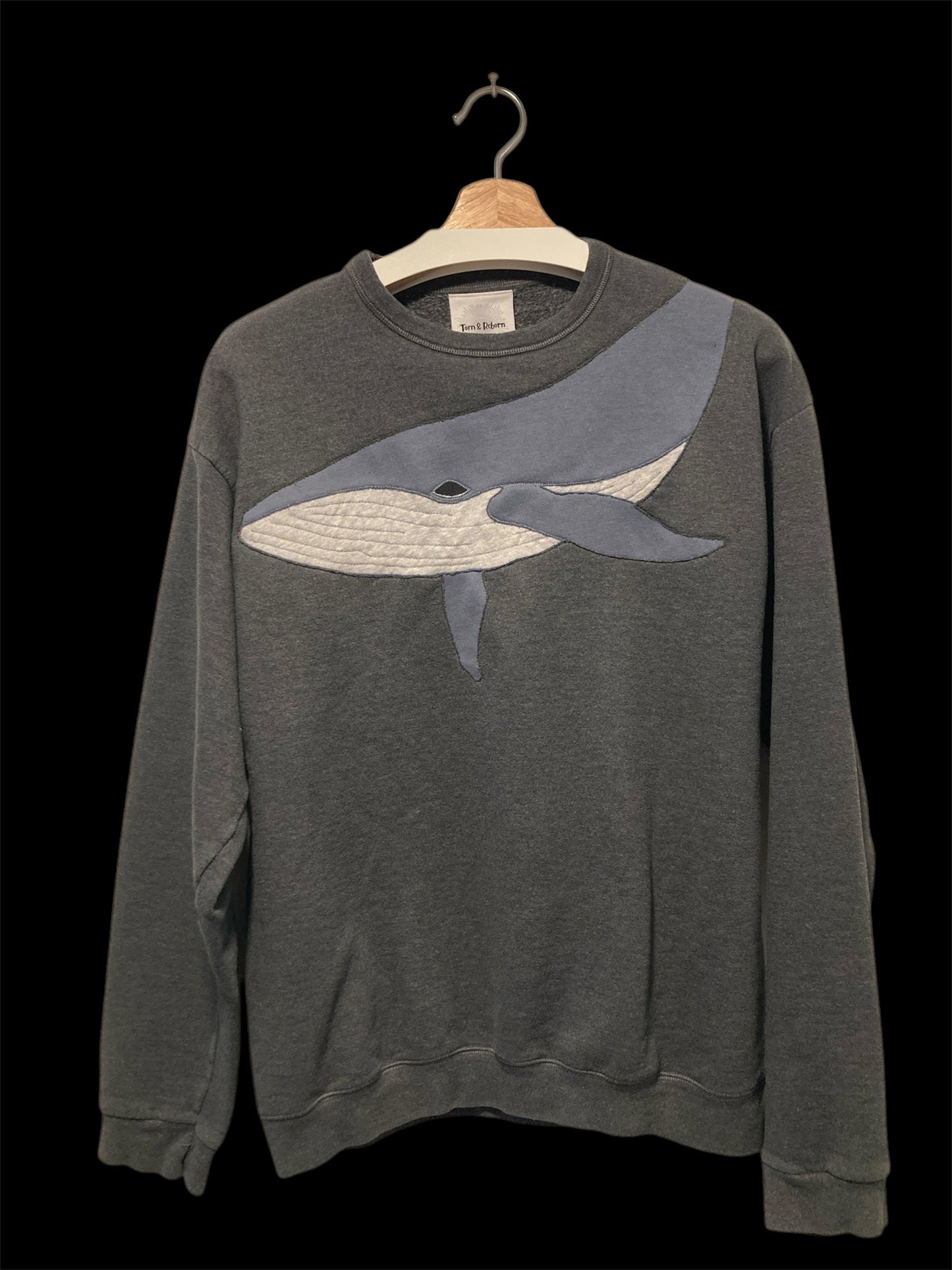 Upcycled whale sweatshirt.