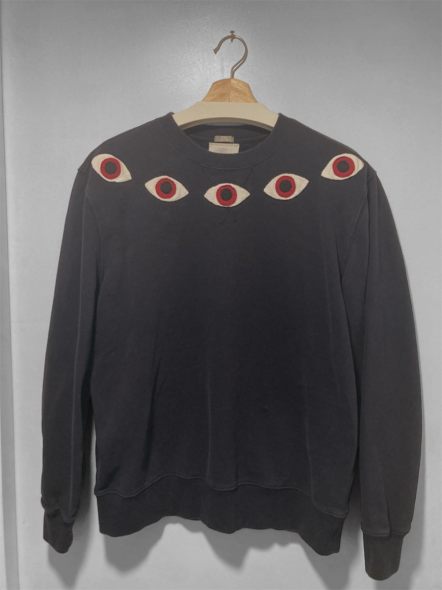 Upcycled eye sweatshirt.