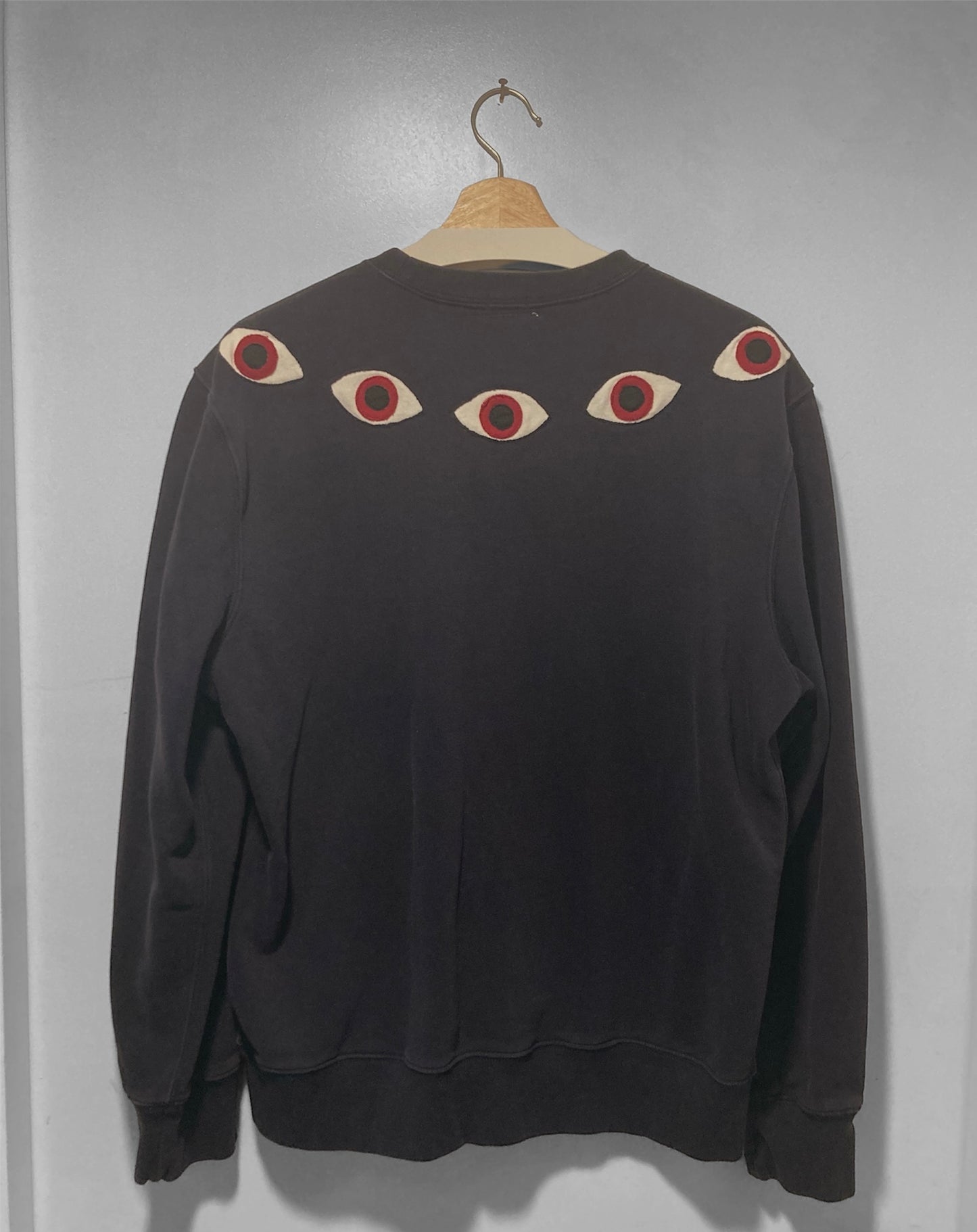 Upcycled eye sweatshirt.